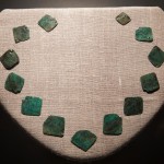 Copper plates made in Europe were once tied together into a necklace for Native Americans. The artifact discovered on Roanoke Island in 2008 by a First Colony Foundation team is one of the few items found there that may date to the 16th century. PHOTOGRAPH BY MARK THIESSEN, NATIONAL GEOGRAPHIC